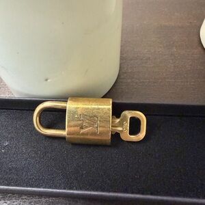 Louis Vuitton Luxurious Gold Padlock with Key